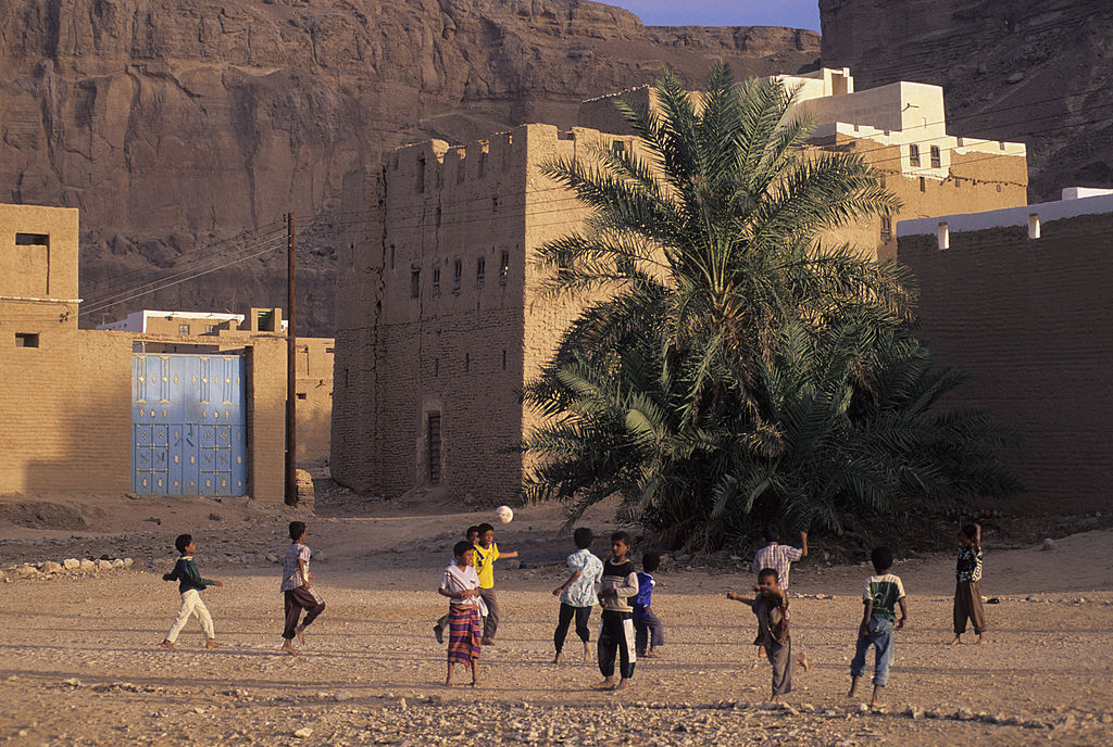 Children playing with a football near Say'un, Yemen