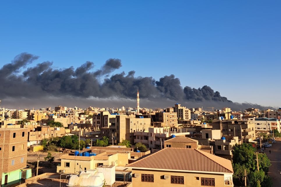 Smoke rises above city rooftops during clashes between the Sudanese Armed Forces and the paramilitary Rapid Support Forces (RSF) in Khartoum, Sudan on 19 April 2023. Photo by Ahmed Satti/Anadolu Agency via Getty Images