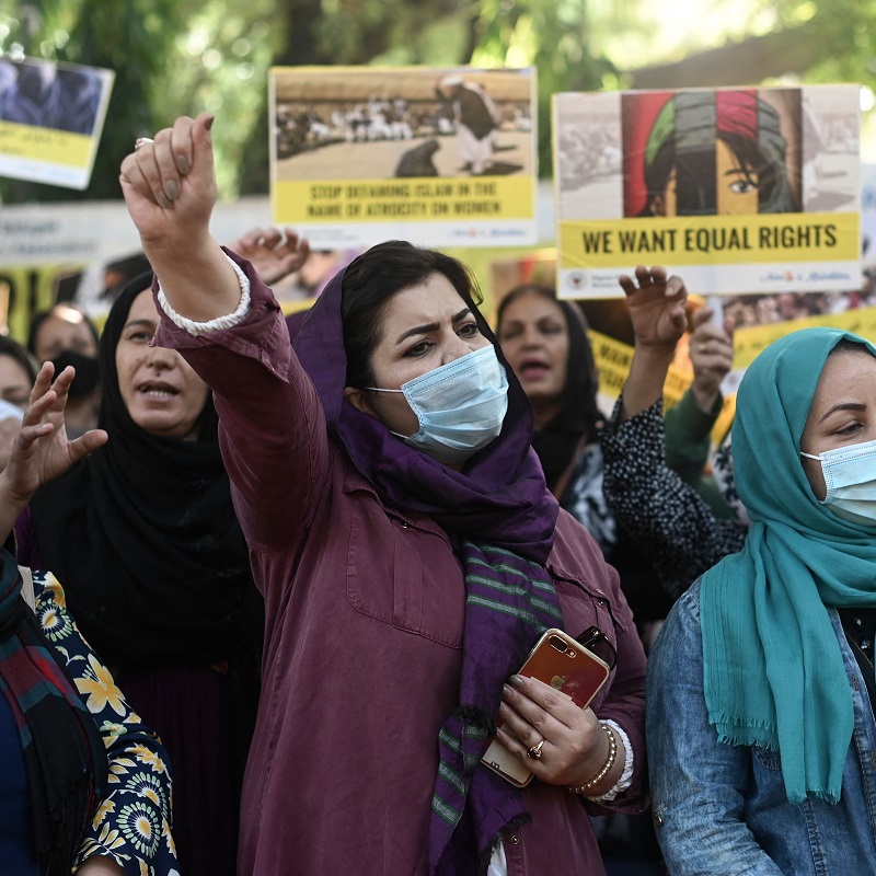 Afghan nationals residing in India and supporters of Afghan Refugee Women's Association hold banners and placards during a demonstration, demanding better rights for women in Afghanistan. (New Delhi, 30 October 2021). Photo by Sajjad HUSSAIN / AFP via Getty Images