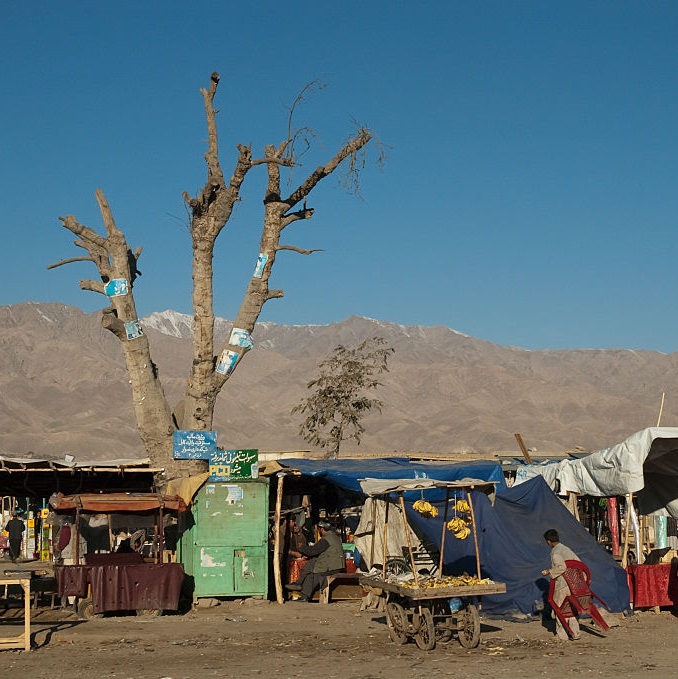 Bazaar with stalls on the Kabul to Charikar road, Parwan Province, Afghanistan. Photo by Insights/ Universal Images Group via Getty Images