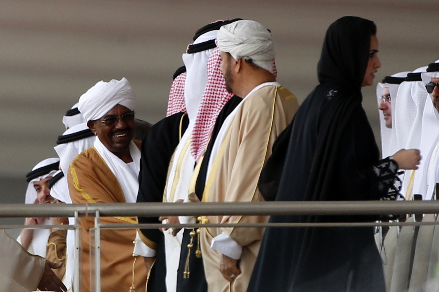 Sudan's President Omar al-Bashir greets delegates at the International Defence Exhibition and Conference (IDEX) at the Abu Dhabi National Exhibition Centre in 2015