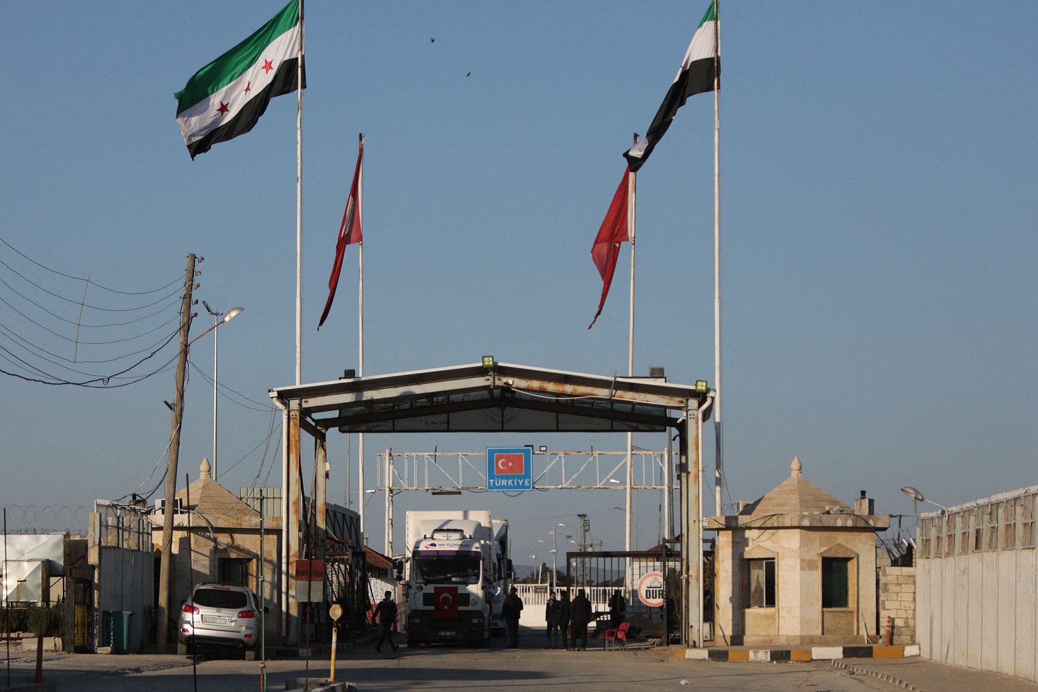 A truck crosses from Turkey into rebel-held north Syria via the Bab al-Salama crossing as part of an aid convoy in February 2023