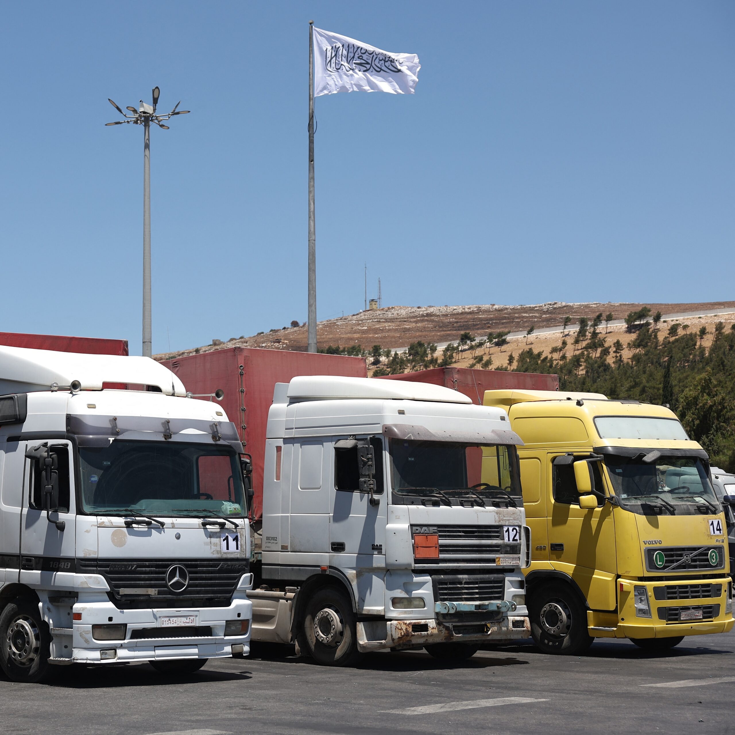 A convoy of trucks carrying humanitarian aid near the Syrian Bab al-Hawa border crossing with Turkey (July 2023).