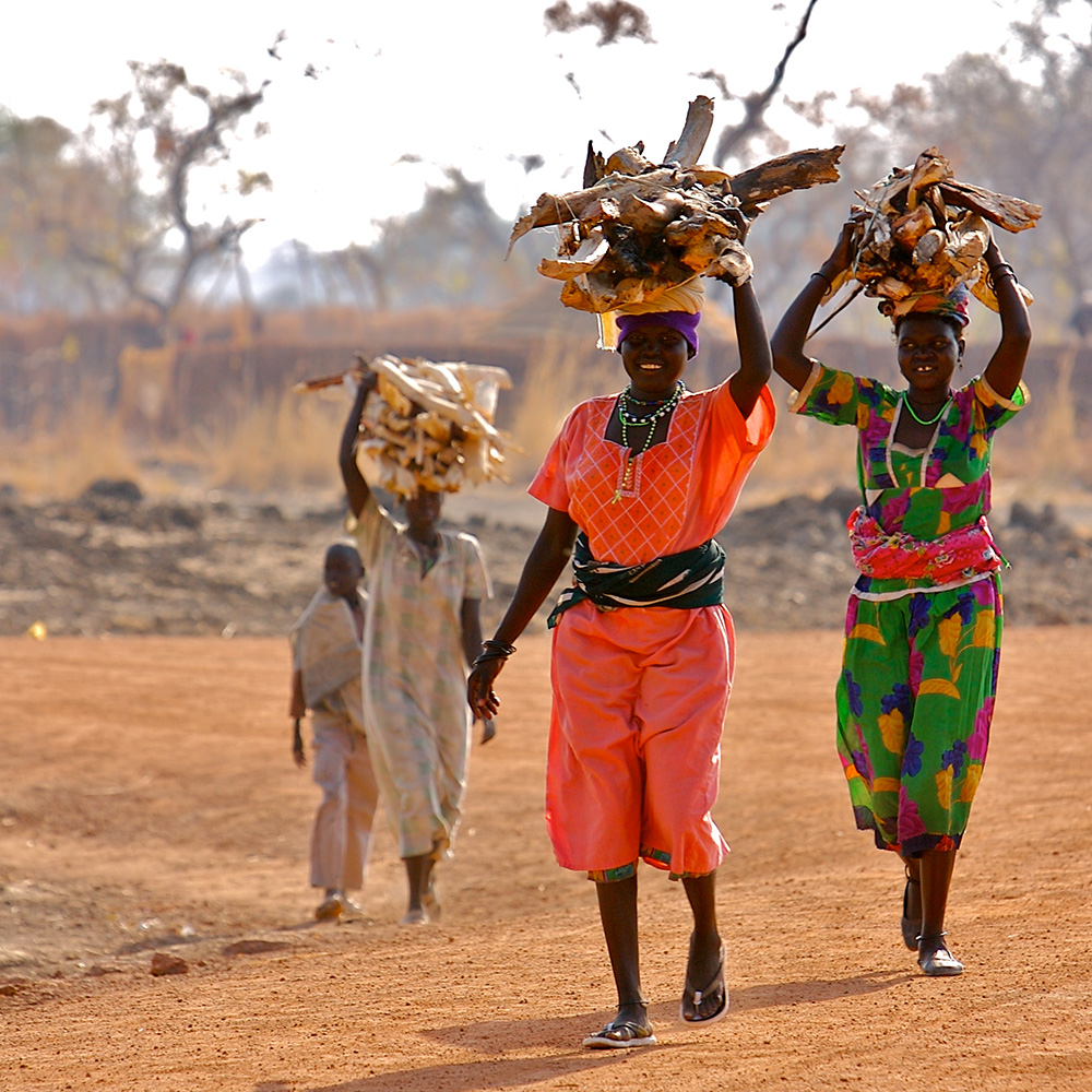 Smiling women walk towards camera