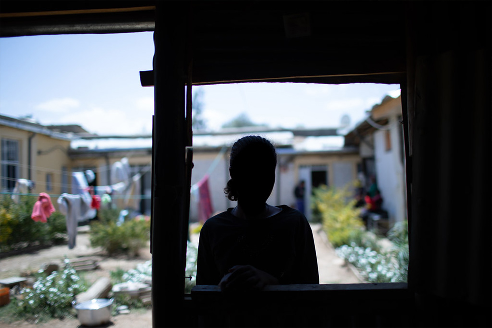 The 18-year-old, survivor of gender-based violence stands for a portrait in Mekelle
