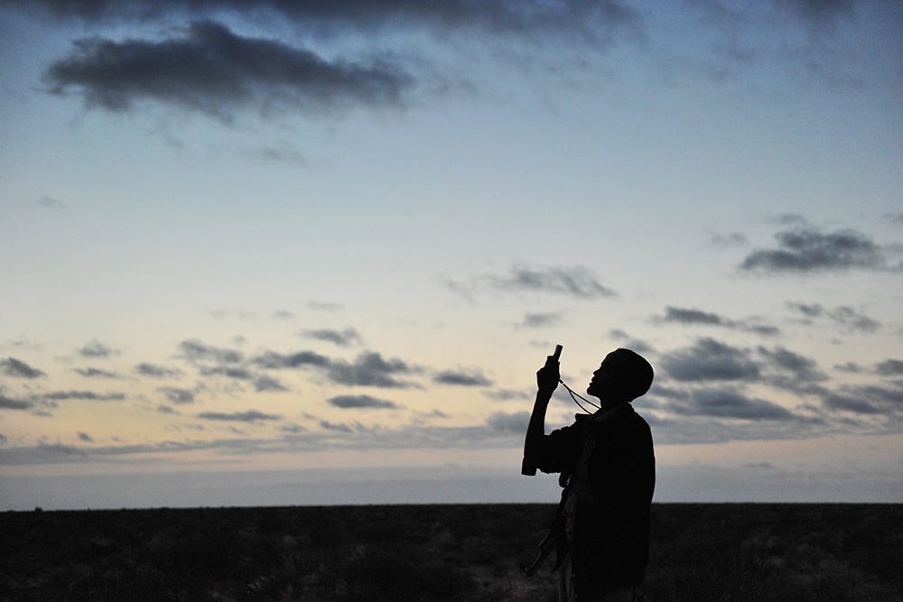 A man searches for network on his phone