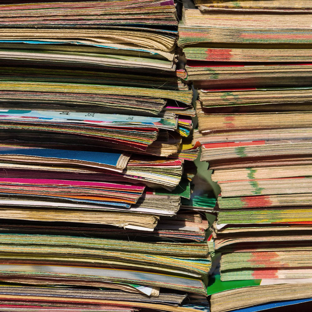 Stacks of colourful reports and papers