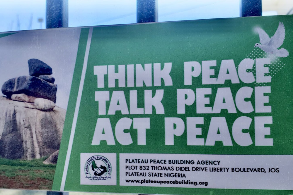 A Sign from the Plateau Peace Building Agency advocating for peace in Jos, Nigeria